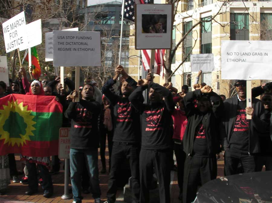 Oromo protest in Oakland, December 2015. Ethiopian marathon runner Feyisa Lilesa crossed his arms above his head, in a gesture of protest, in his silver medal finish at the Rio Olympics men's marathon. Credit: Oakland Institute.