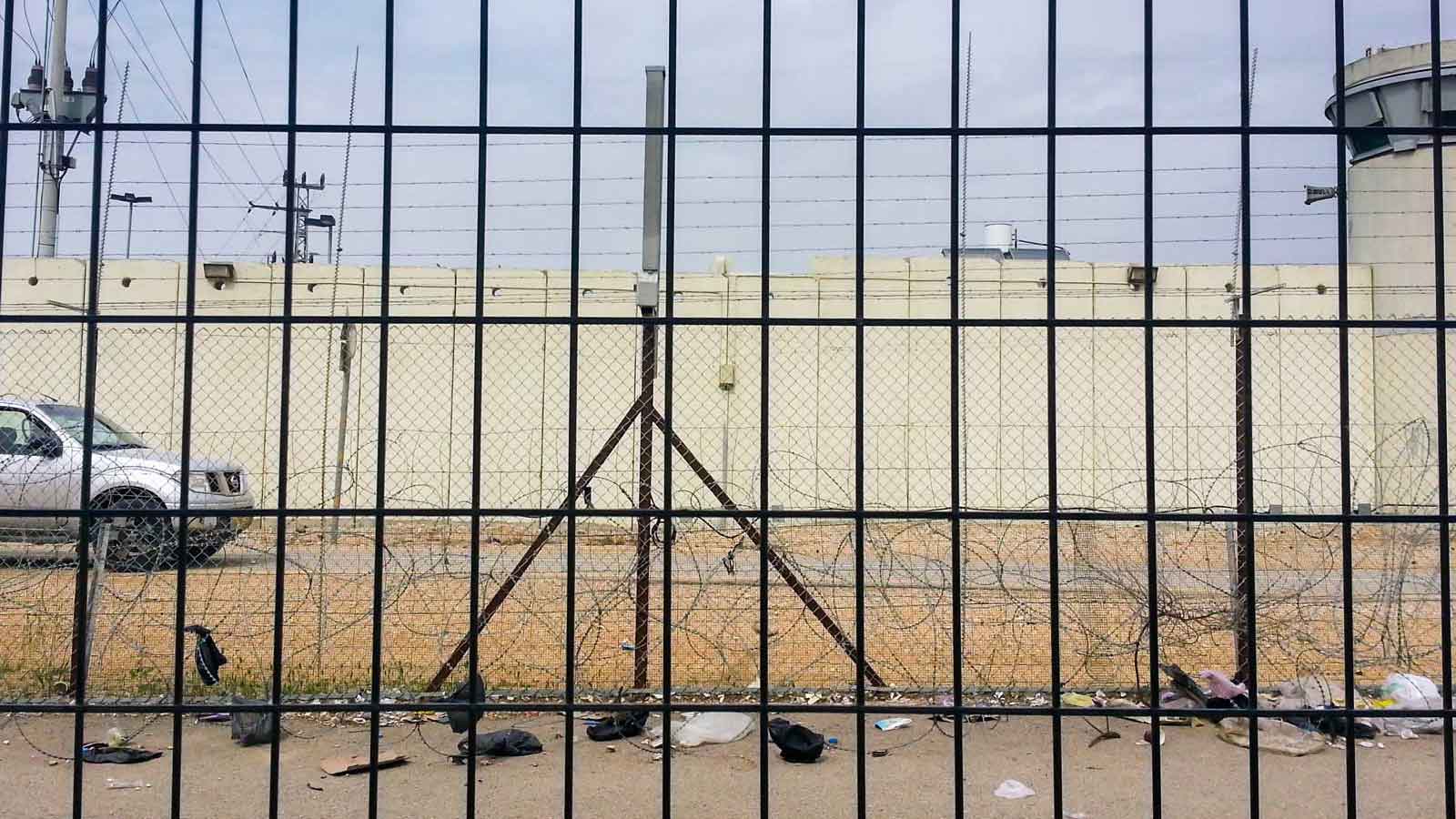 Separation wall and fence in Qalqilya. Credit: The Oakland Institute